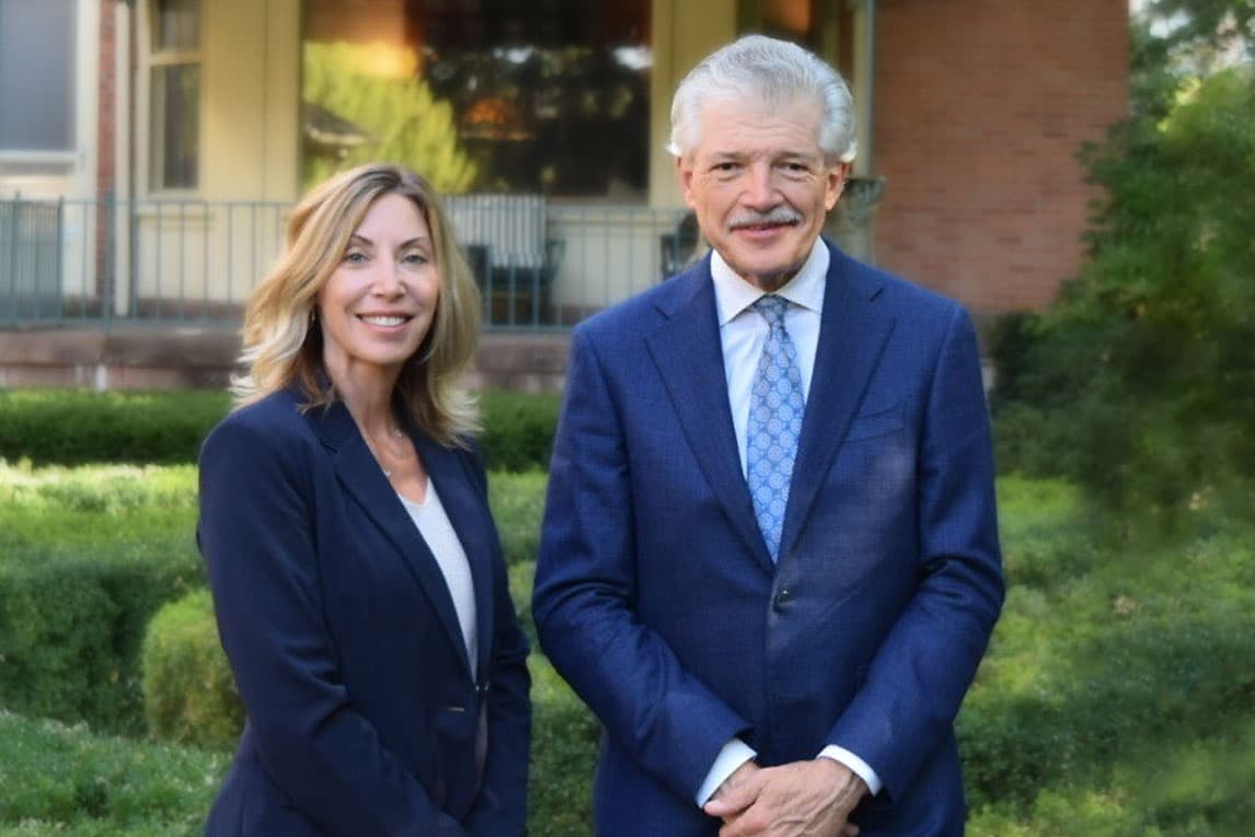 Dr. Quatela and Julie A. Chatt standing next to each other smiling