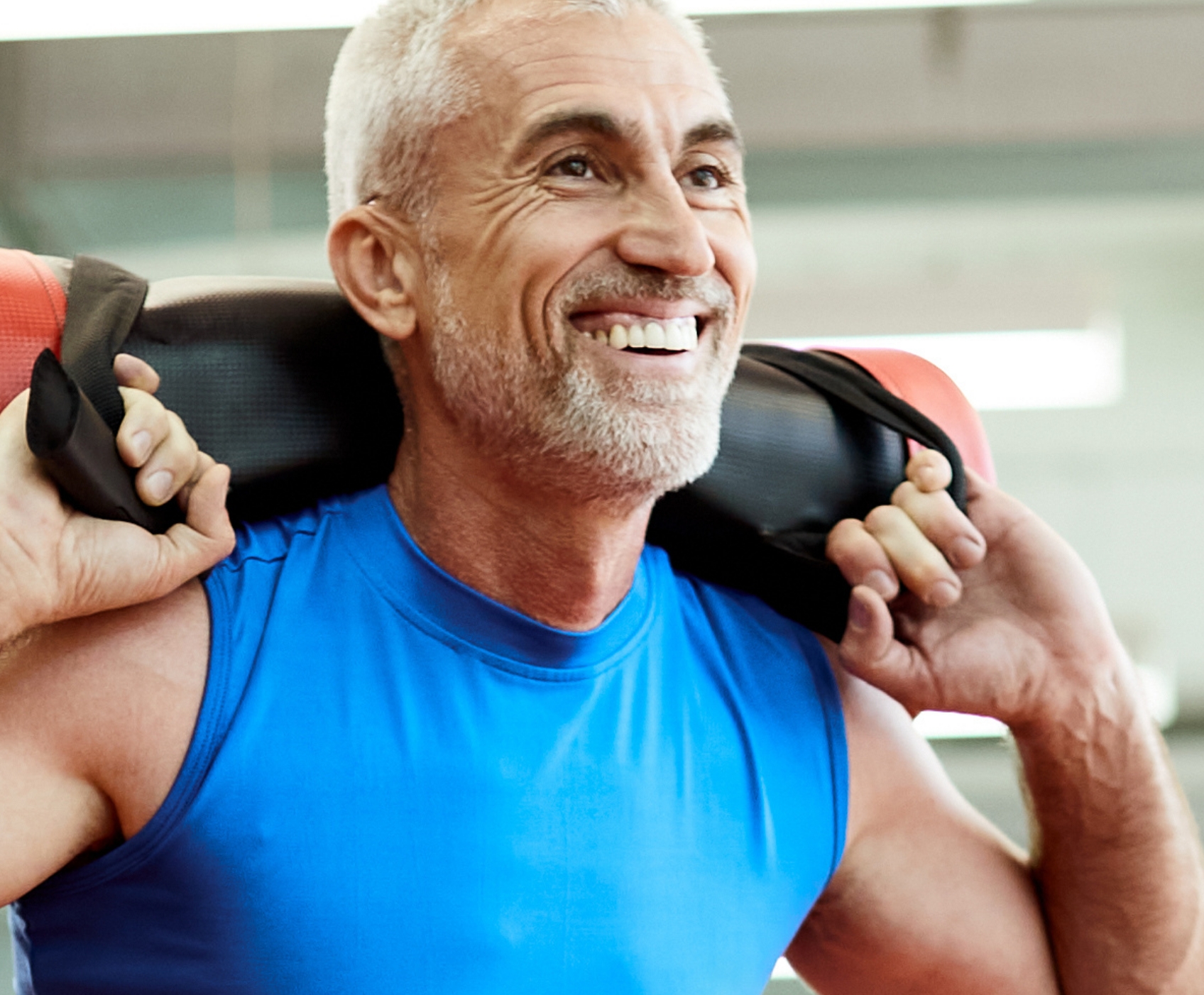 Man working out wearing a blue workout shirt