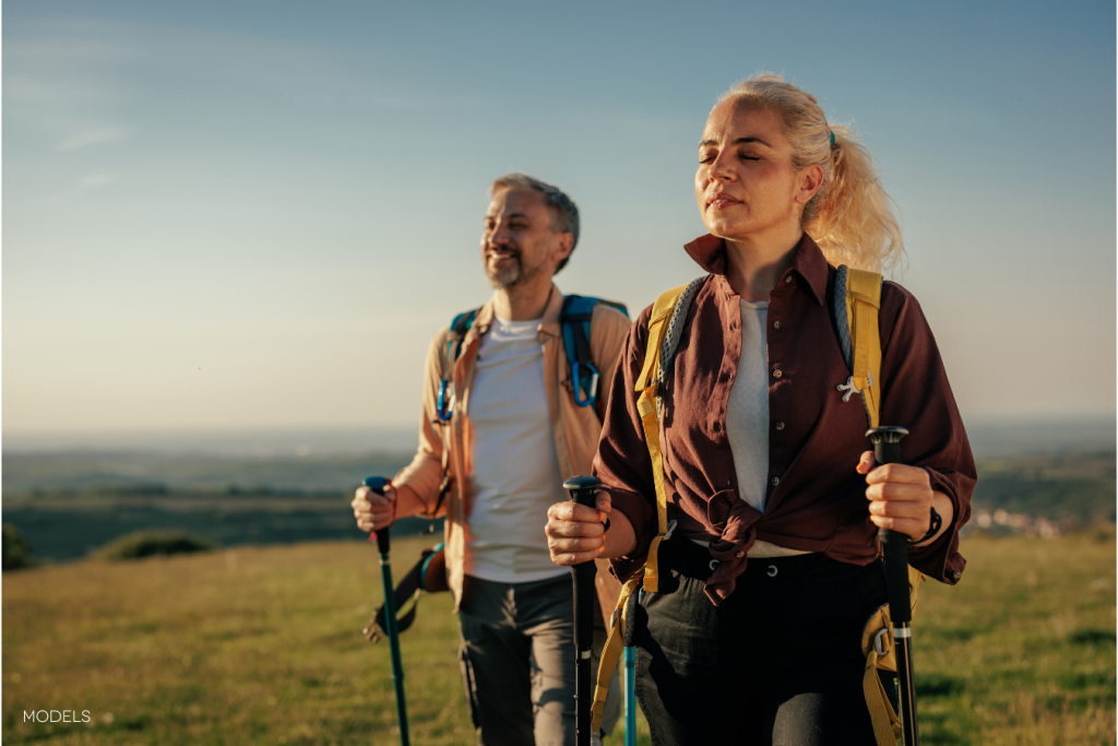 man and woman hiking